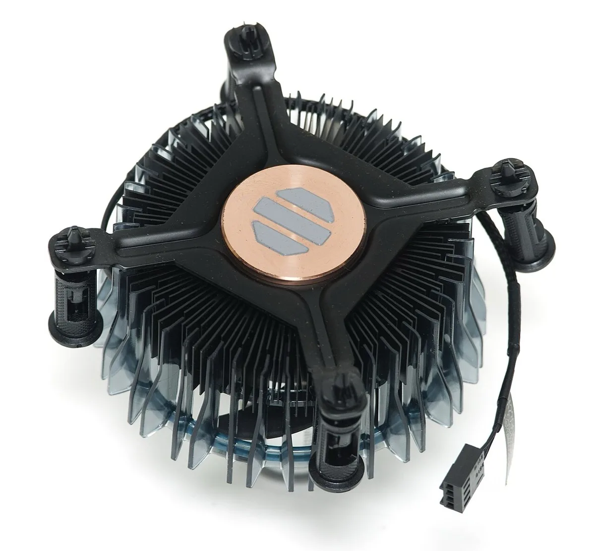 Underside of a stock Intel CPU cooler, showing the round copper cold plate with gray thermal paste applied to it